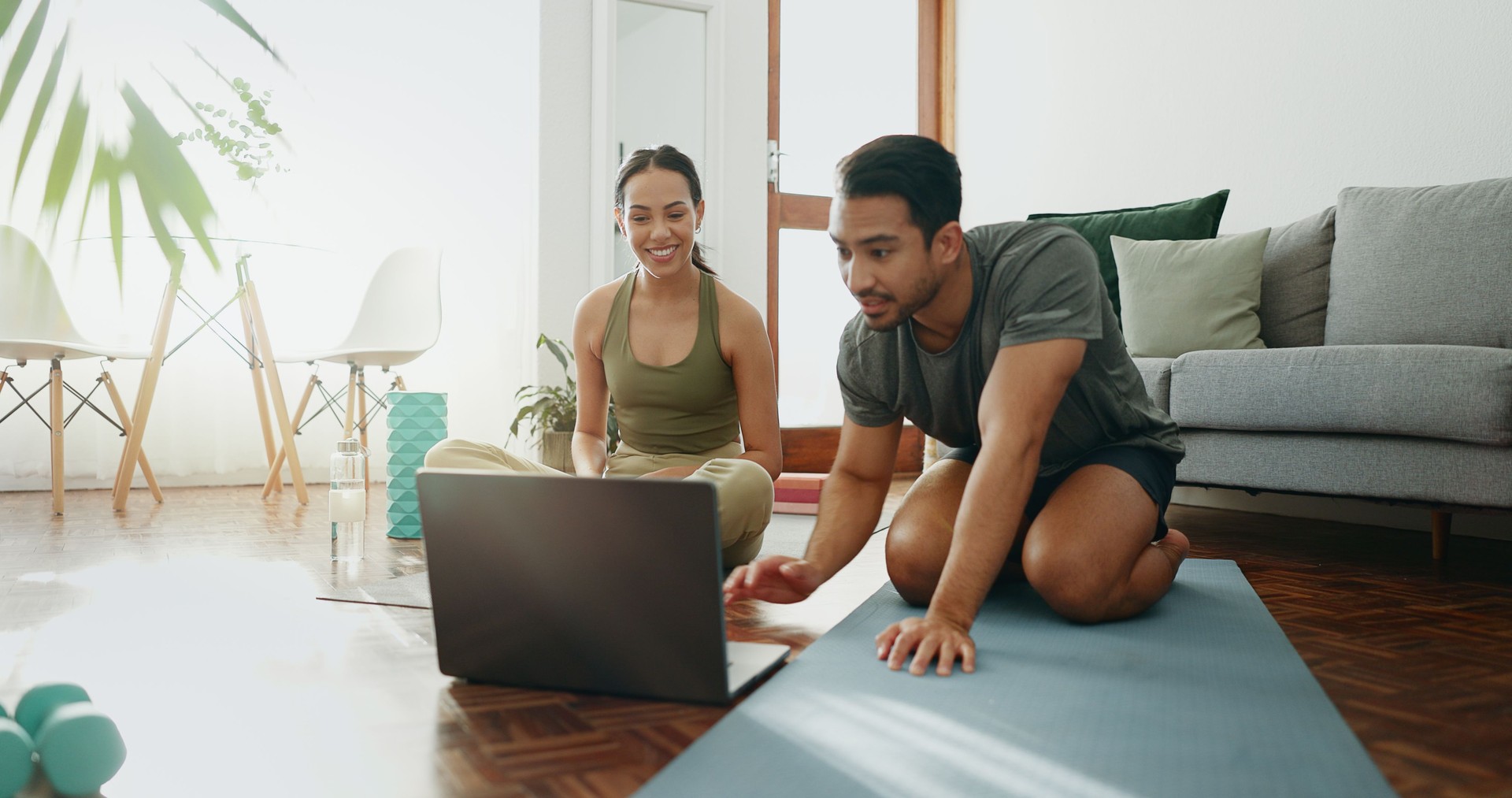 Happy couple, laptop and workout with mat for online class, tutorial or routine exercise together at home. Man and woman on computer for health tips, training or steps in fitness or training on floor