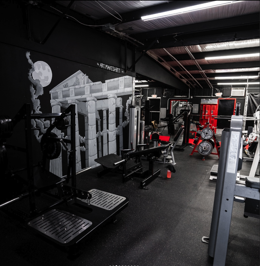 Leg training equipment at Alpha Omega private gym in Pinellas County - squat racks and leg machines